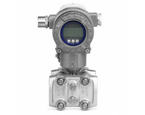 Industrial digital pressure transmitter mounted on a metallic valve, featuring a round display and four-bolt connections.