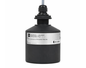Black Prosonic FDU sensor housing with label 'Endress+Hauser Prosonic FDU' and cable on top; industrial measurement instrument head.