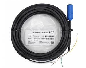 Coiled black industrial sensor cable with a blue connector and exposed yellow/green wires on a white background, ready for installation.