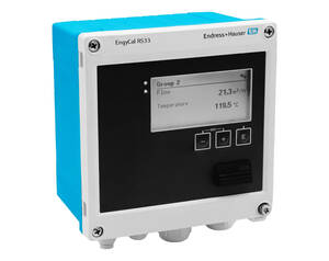 Industrial process display module with blue enclosure and black front panel; screen shows Flow 21.3 m³/h and Temperature 119.5°C (Group 2).