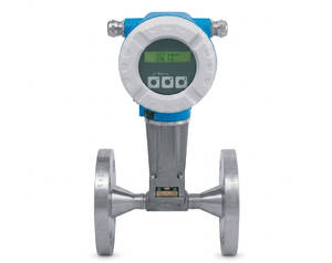 Industrial inline flow meter with a round digital display on top, blue housing, and flanged pipe connections on both ends.